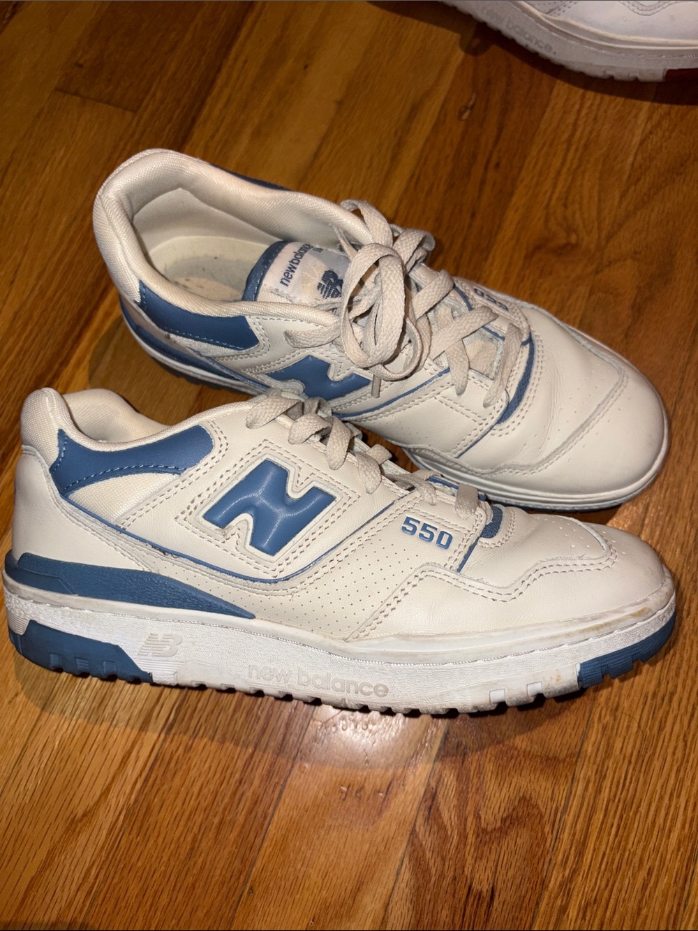 New Balance White Sneaker with Light Blue Accents